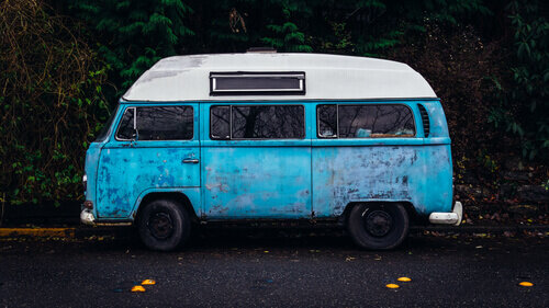 Blue bus parked outside.