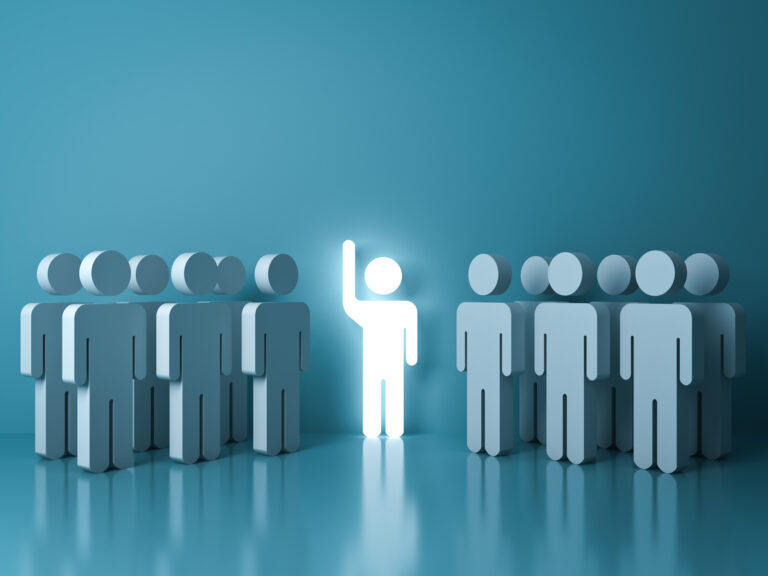 Illustration of people with one bright white one in the center with hand up.