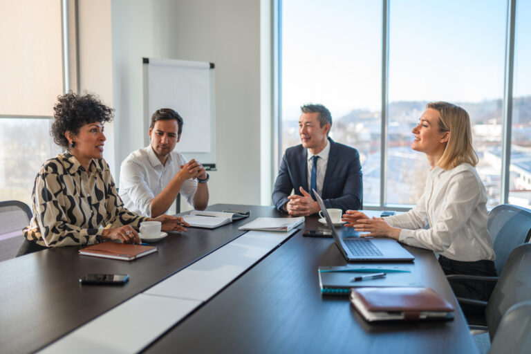 team in boardroom meeting