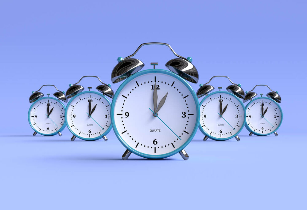 Five clocks at 1:00 on a purple background.