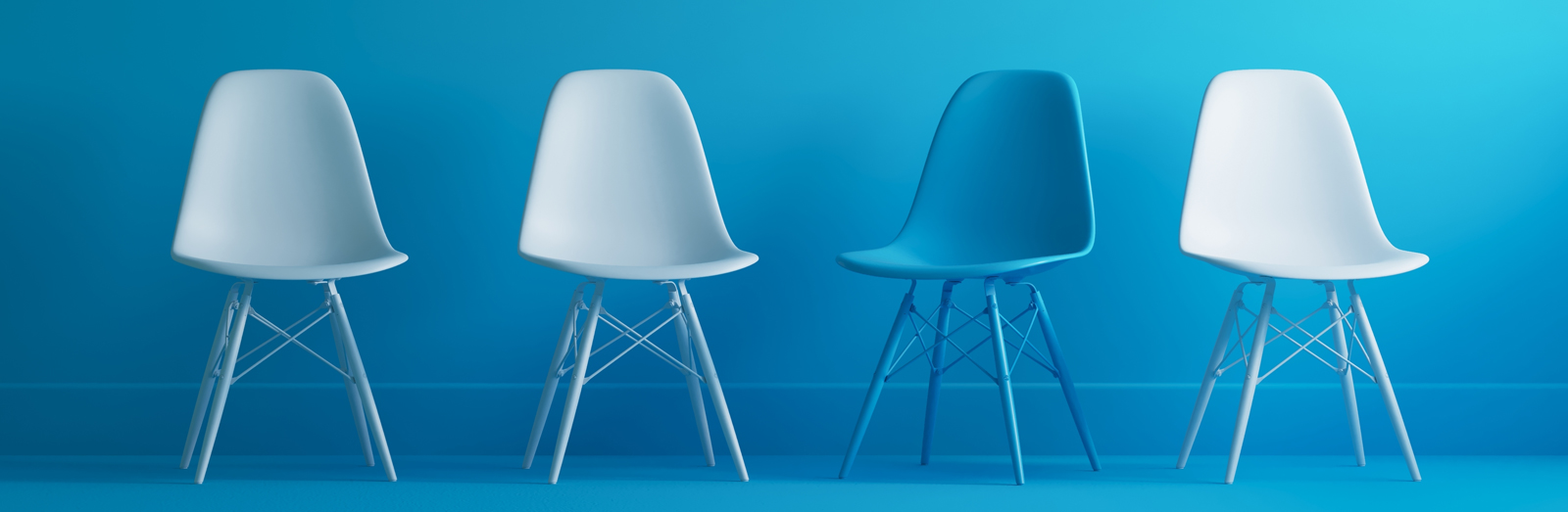 Four chairs and blue background.