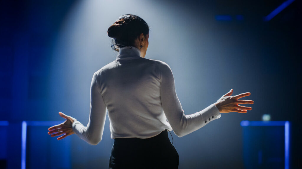 Woman giving presentation.