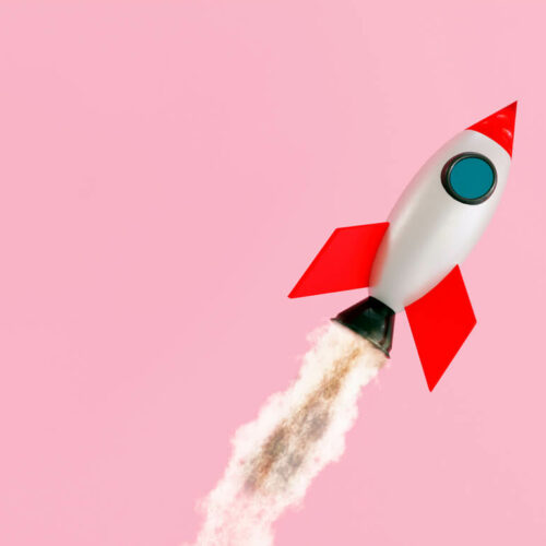 rocket with pink background launching