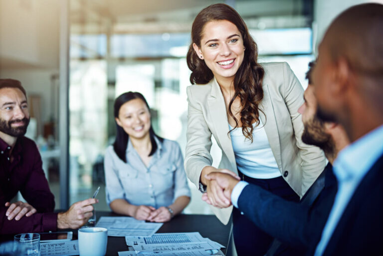 woman shaking hands with man