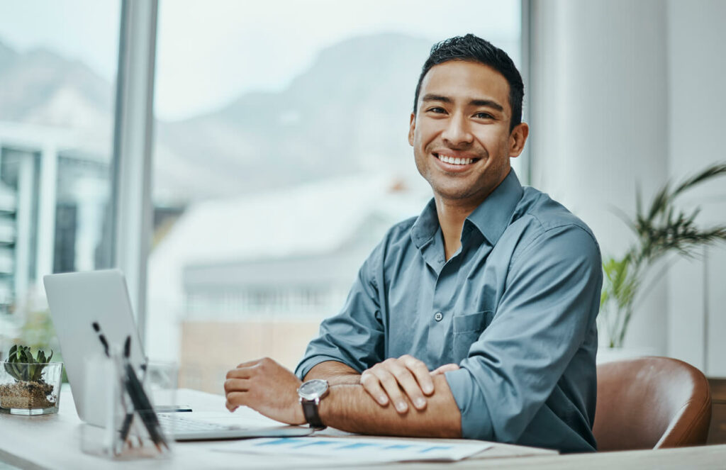 Salesperson at desk smiling