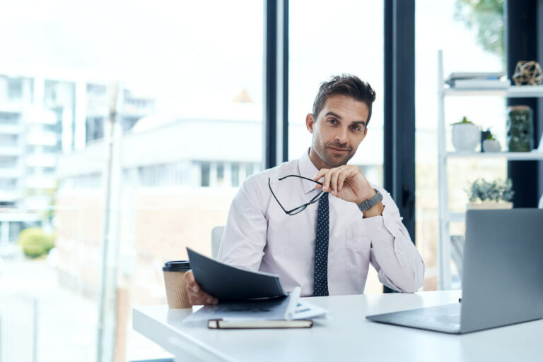 Software Enterprise salesperson at desk thinking about work.