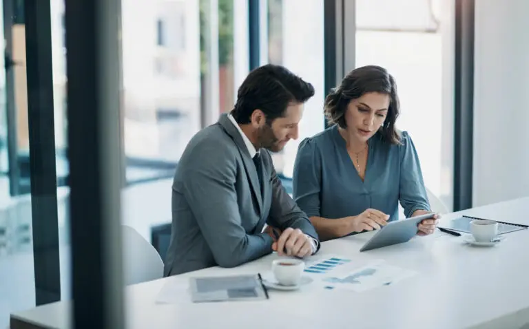 business sales professionals in a conference room discussing talent pipeline