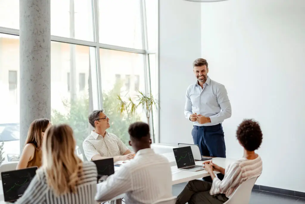 SaaS tech sales and marketing team in boardroom