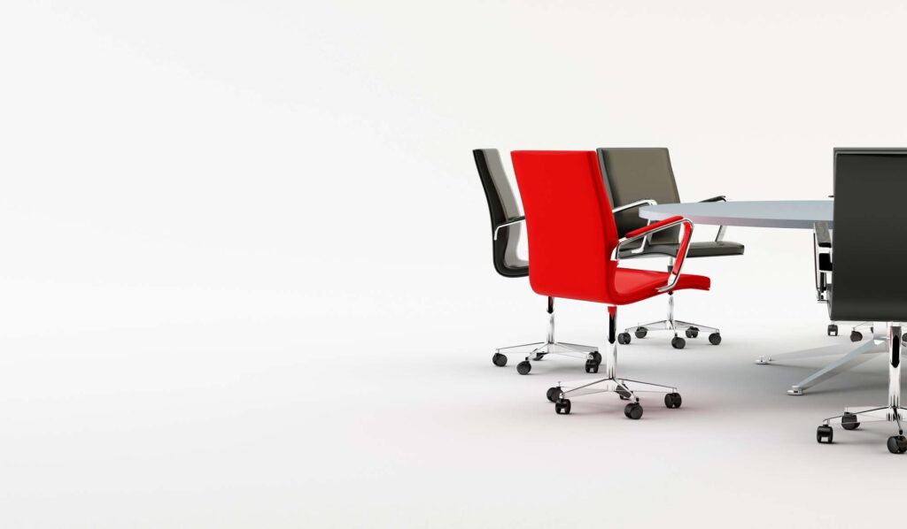 Modern conference room with red chairs – professional hiring and recruitment setting.