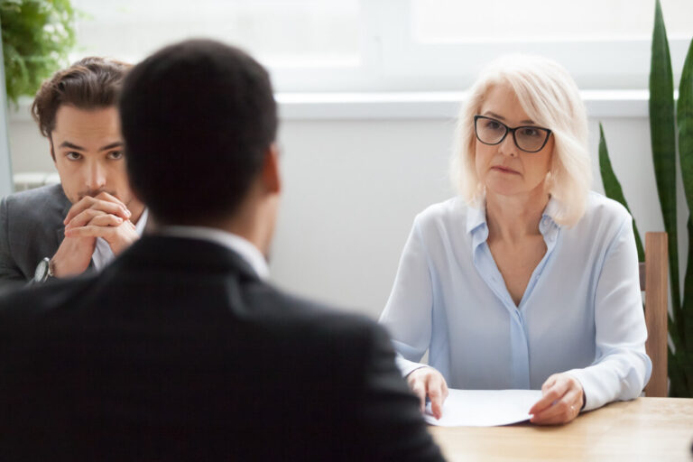 interview with woman and two men at in the interview room