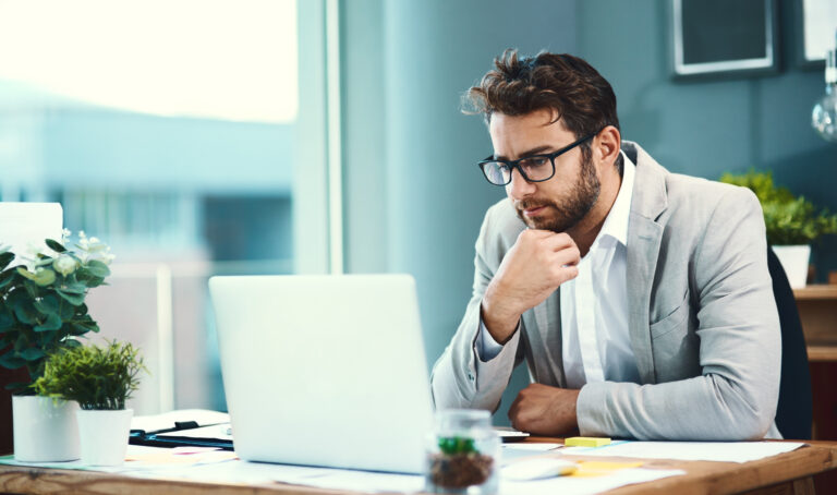Professional sales representative reviewing a new logo opportunity on a laptop